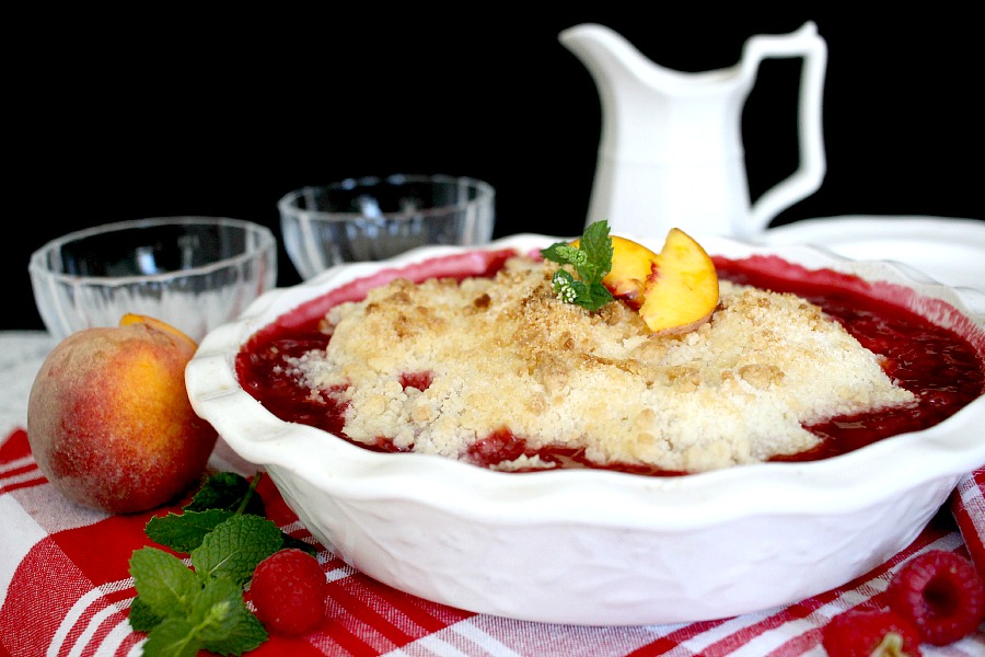 Make an easy Peach & Raspberry Crisp using fresh summer peaches and plump raspberries with a lovely crumb topping. Serve with a scoop of vanilla ice cream.