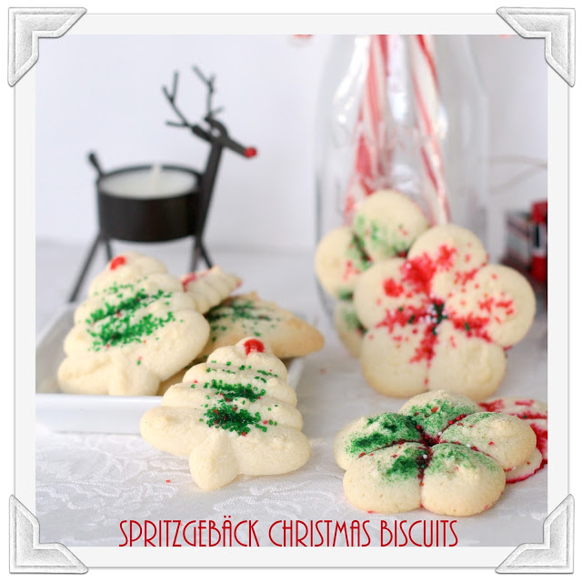 Spritz or Spritzgebäck cookies, are festive and buttery, made using a cookie press then decorated with colorful sugars. Easy to make Christmas favorite.
