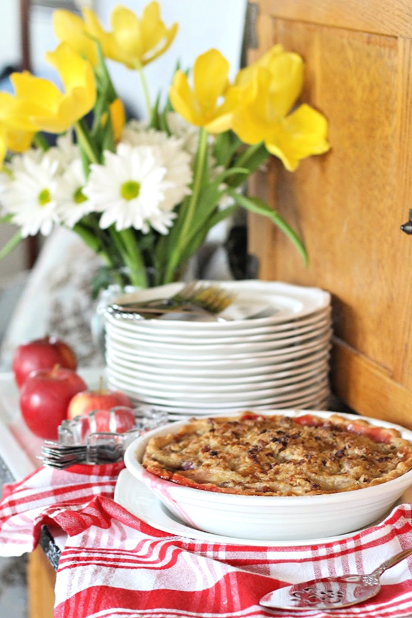 Easy recipe for cranberry apple pie with pecan streusel is an exciting combination of sweet and tart with a crunchy topping that's especially delicious served with a scoop of vanilla ice cream!