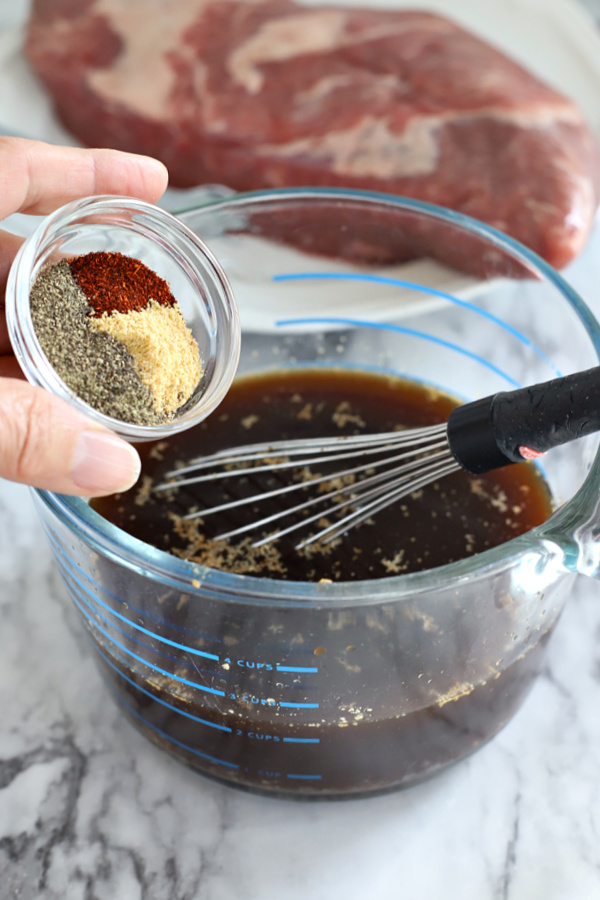 Adding spices for making Slow Cooker Beef Brisket