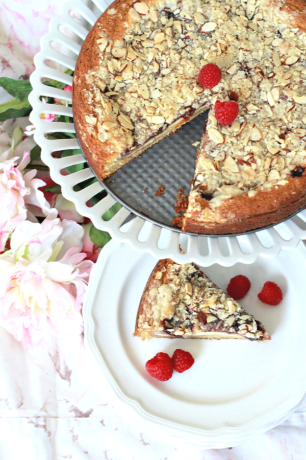 Easy recipe for Raspberry Cream Cheese Coffee Cake with a deep golden brown crust and sweet cream cheese filling with raspberry and crunchy almond topping.