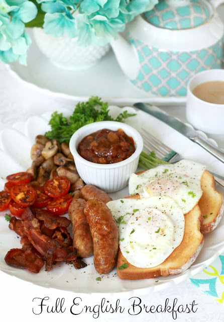 Full English Breakfast of sausage, bacon, eggs, toast, beans, tomato and mushrooms