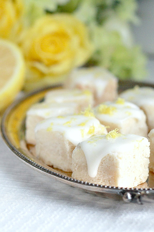 Lemon glazed buttery shortbread are delicious little cookie bites. Easy recipe for delicate and crumbly English tea time biscuits. 