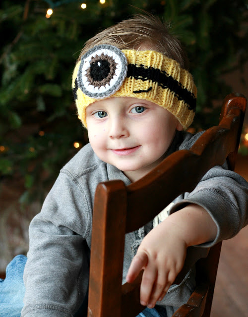 Adorable and easy knitted headband FREE pattern with crocheted eye keeps those little ears warm in a fun way.