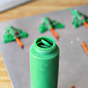 Melted chocolate disks for making Christmas tree cupcake toppers