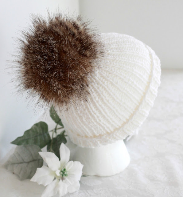 Make your own faux fur pom poms for hats and crafts easily and inexpensively. Check out this tutorial, How-to Faux Fur Pom Pom on Knitted Toque with link to easy knitted hat pattern.