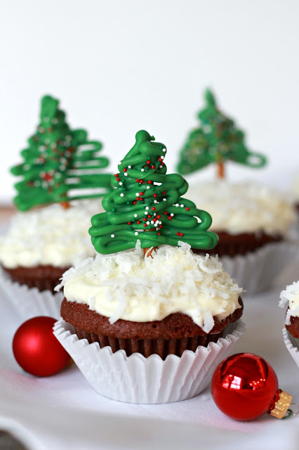 Easy to make, Chocolate Pretzel Christmas Tree Cupcake Toppers look so festive atop coconut frosted cupcakes. A yummy and decorative Christmas treat.