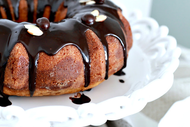 How to make an easy Coffee Marbled Bundt Cake with Dark Chocolate Ganache. Great birthday or any occasion dessert. Swirls of yellow cake and coffee flavored cake with a decadent dark chocolate ganache drizzled on top.