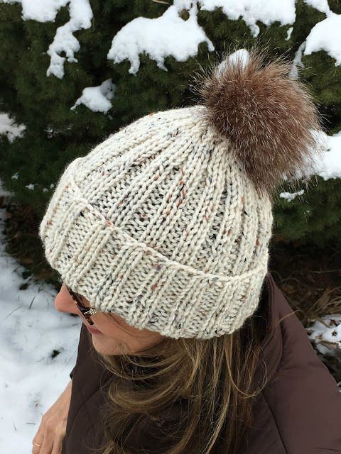 Keep warm with these stylish knitted hats and messy bun with links to easy patterns. Make your own faux fur pompom with easy tutorial.