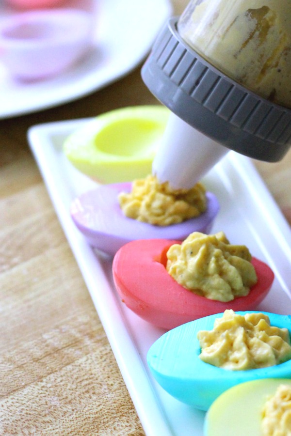 Pastel colored deviled eggs are almost too pretty to eat. The egg whites are dyed and then filled with the yolk mixture. A favorite Easter brunch dish or served as an appetizer with dinner.