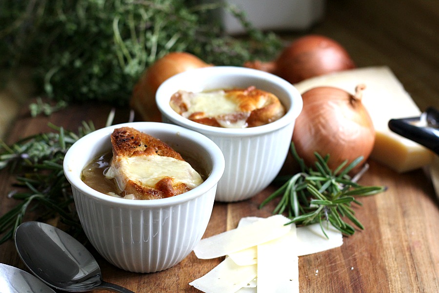 Easy recipe for French Onion soup in a rich beef broth with sweet caramelized onions and topped with toasted baguette and melty cheese. 