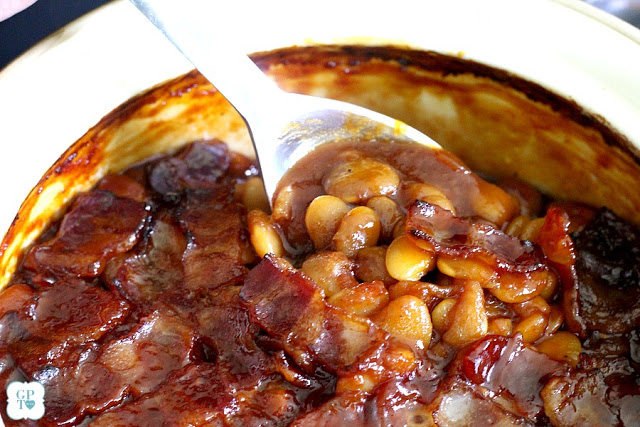 Homemade, old fashioned baked beans take a little time but so worth it! Tender navy or Lima beans in a brown sugar and molasses sauce is a perfect side. 