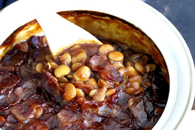 Homemade, old fashioned baked beans take a little time but so worth it! Tender navy or Lima beans in a brown sugar and molasses sauce is a perfect side. 