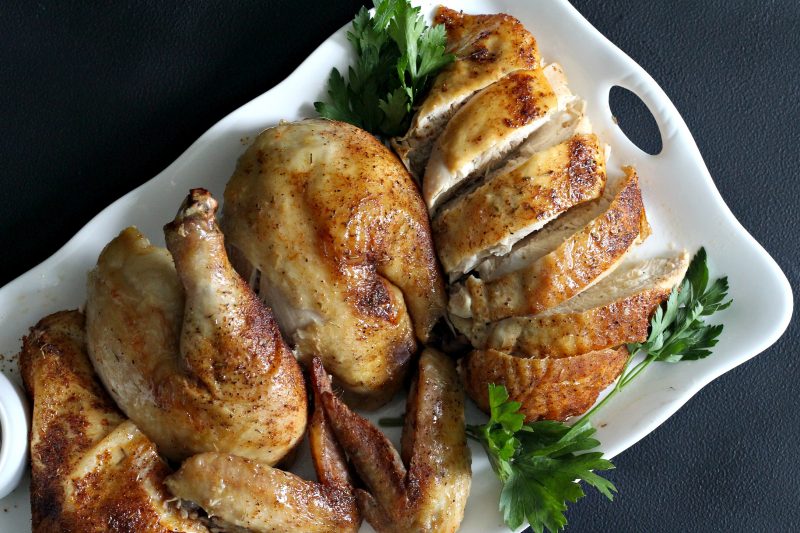 Easy recipe for moist and tender chicken, slow roasted in the oven with dry rub spices. 