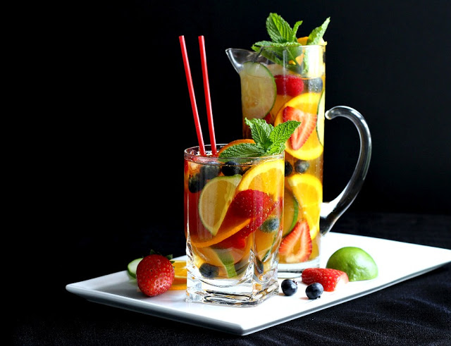 Easy recipe for a pitcher of the perfect Pimm's cup! Iconic cocktail from London we first enjoyed at  the Sherlock Holmes Pub. Pimm's No 1 with cucumber, berries and Sparkling Lemonade or Ginger ale for a refreshing beverage.  