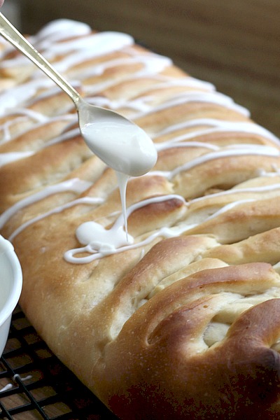Frosted Apple Danish Braid made easy with dough from Bread Machine. Filled with cinnamon and apples and topped with frosting and toasted almonds. Breakfast or snack treat!