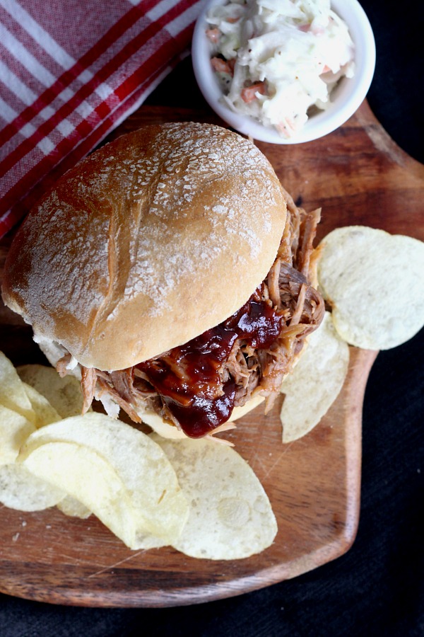 Roast an inexpensive pork shoulder in the oven slow and long for incredibly tender, delicious pulled pork. Pile on a roll with your favorite barbecue sauce for amazing pulled pork sandwiches!