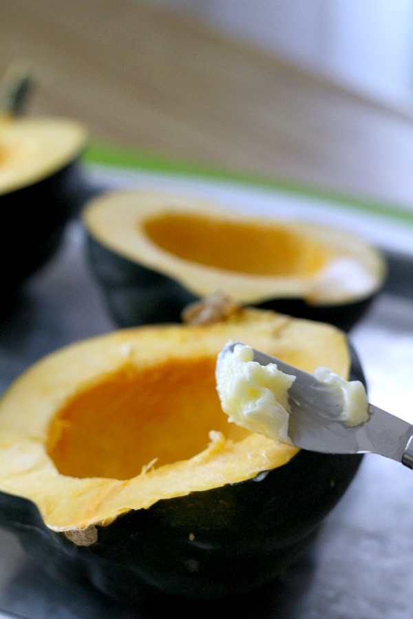 Baked acorn squash couldn't be easier. Bake the sliced and seeded squash with butter and maple syrup until fork tender. A lovely autumn side dish.