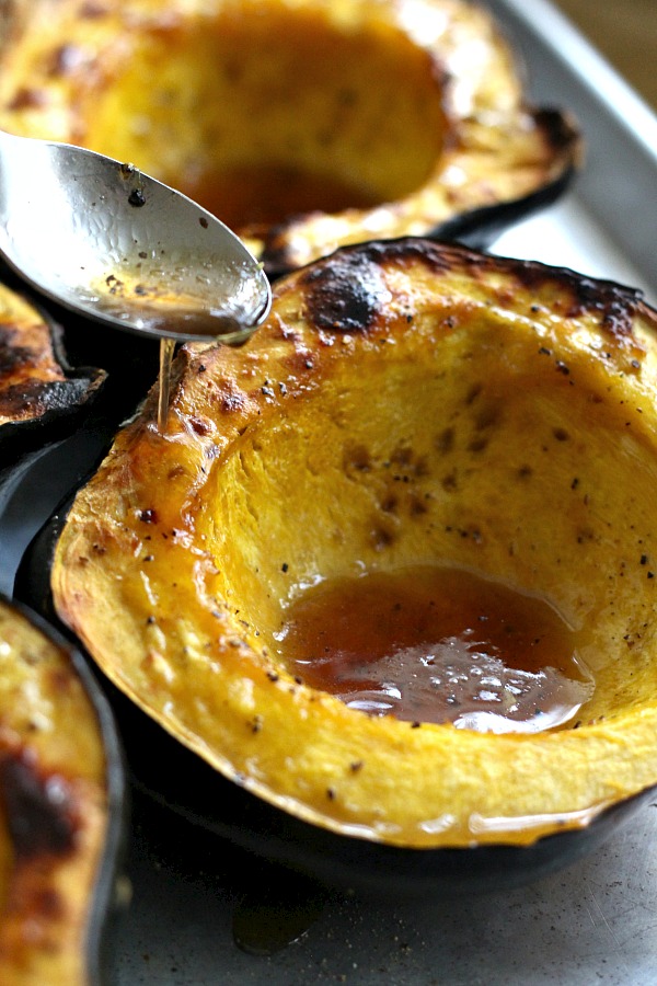 Baked acorn squash couldn't be easier. Bake the sliced and seeded squash with butter and maple syrup until fork tender. A lovely autumn side dish.