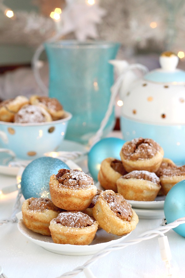 These sweet little tartlets called Pecan Tassies are like having a scrumptious bite-sized pecan pie. Sweet filling in a cream cheese pastry cup, they are also known as Nut Lassies.