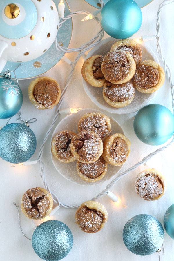 These sweet little tartlets called Pecan Tassies are like having a bite-sized pecan pie. Sweet filling in a cream cheese pastry cup, they are also known as Nut Lassies.