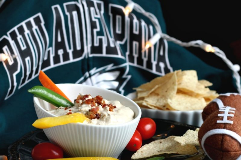 This retro, crowd-pleasing zesty dip never goes out of style. Onion Soup Horseradish and Bacon Dip is thick, creamy and stands up to fresh veggies, crackers and hearty chips. Serving for Super Bowl Sunday and cheering on the Philadelphia Eagles. Fly, Eagles, Fly!
