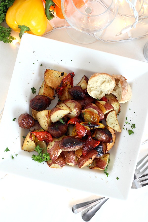 Super easy roasted sausage potatoes and peppers. Just toss with olive oil, add German brats. Season as desired and roast until browned and crispy. Delicious, whole meal in a pan.