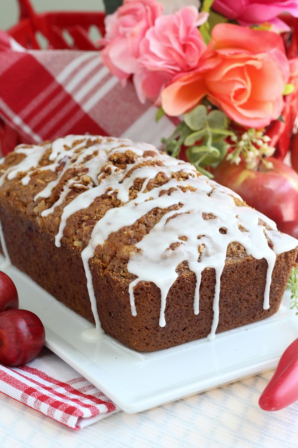 Easy recipe for frosted applesauce bread full of warm flavors of cinnamon, allspice & nutmeg. You don't even need a mixer to make this delicious quick bread