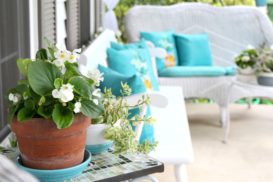 A little updating, easy decorating and sheer curtains give the porch curb appeal. Summer on the porch is the perfect place for quiet time or entertaining.