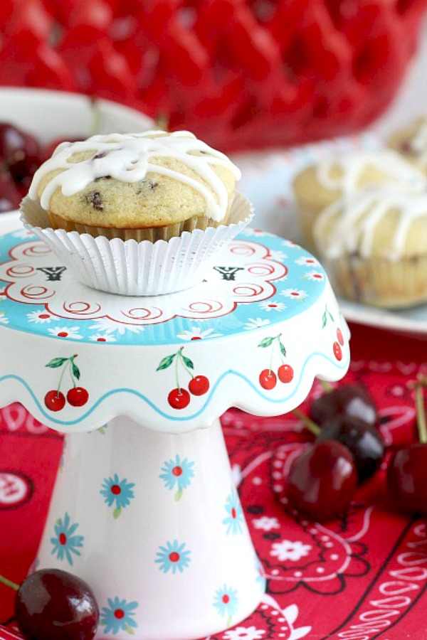 Lots of cherries and chocolate chips are folded into the batter of these delicious glazed Cherry Chocolate Chip Muffins for a delicious treat.