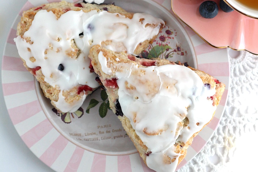 Brighten breakfast or tea time with this easy recipe for frosted Strawberry blueberry scones. Lovely for Mother's Day or to share with friends & coworkers.