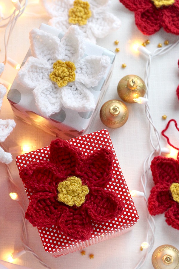 Decorate gifts, wreaths, sew to hats, pillows, or hang as ornaments pretty crochet poinsettia flowers. Festive for holiday decorating and quick and easy to make. 