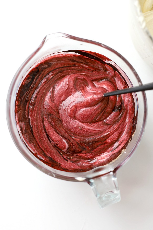From scratch recipe for a moist red velvet marbled cake made in a Bundt pan has a lovely icing just right for Valentine's Day or celebrating a birthday.