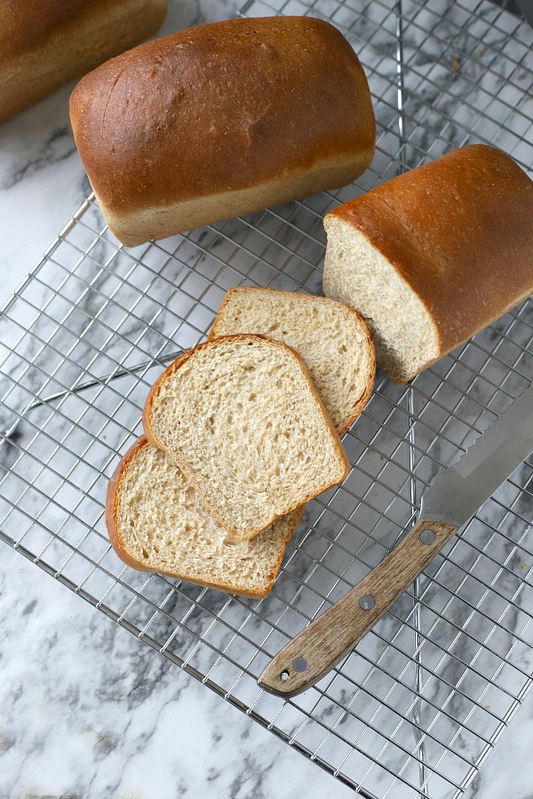 Easy recipe for delicious homemade honey whole wheat bread uses a bread machine to make the dough. Shape into loaves and bake. Perfect for slicing too.