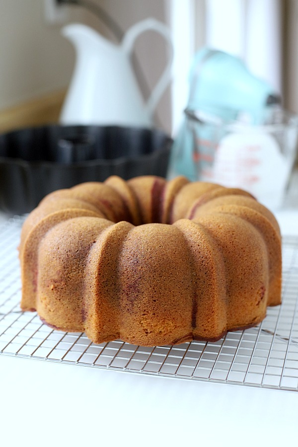 From scratch recipe for a moist red velvet marbled cake made in a Bundt pan has a lovely icing just right for Valentine's Day or celebrating a birthday.
