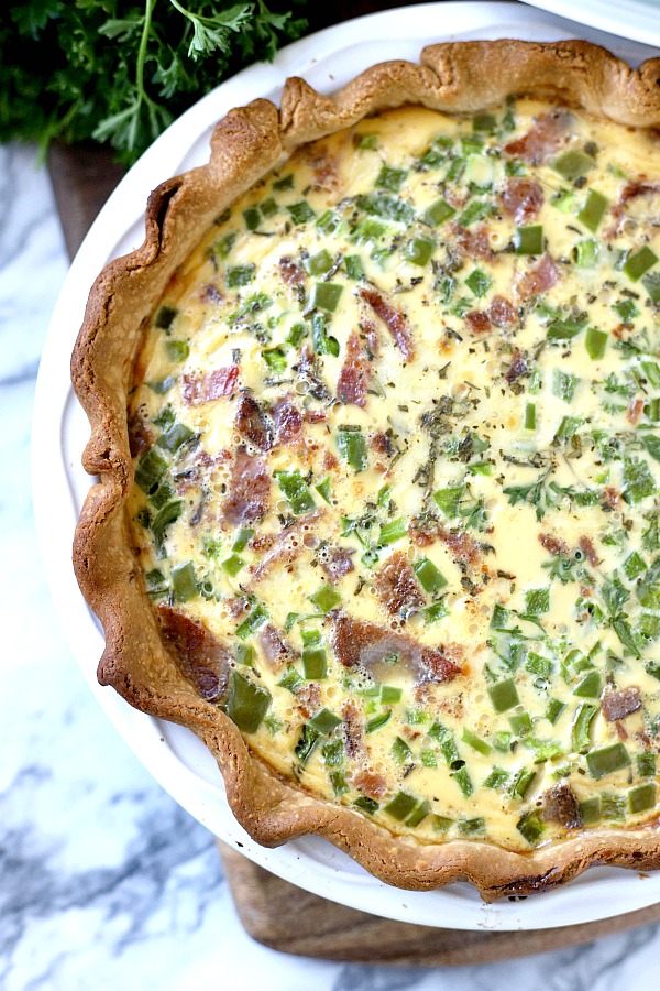 For breakfast, brunch or dinner, it doesn't get easier than classic quiche Lorraine. A creamy filling of Swiss cheese, veggies and bacon (or ham) bakes in a flaky crust. Just as perfect for entertaining as it is for a weeknight dinner. 