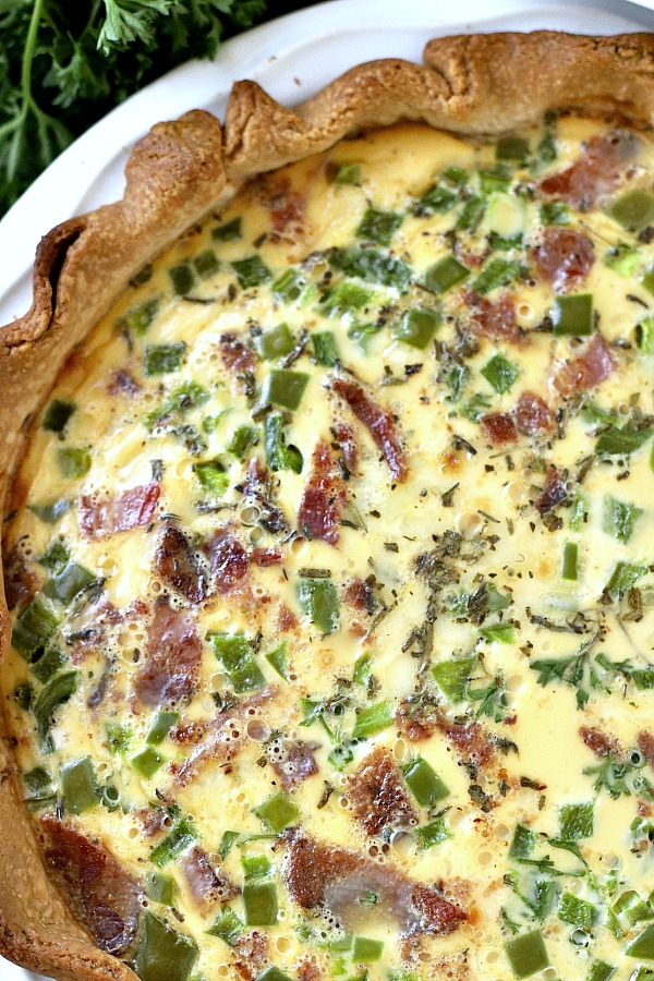 It doesn't get easier than classic quiche Lorraine for breakfast, brunch or dinner. A creamy filling of Swiss cheese, veggies and bacon (or ham) bakes in a flaky crust. Just as perfect for entertaining as it is for a weeknight dinner. Serve warm or at room temperature.
