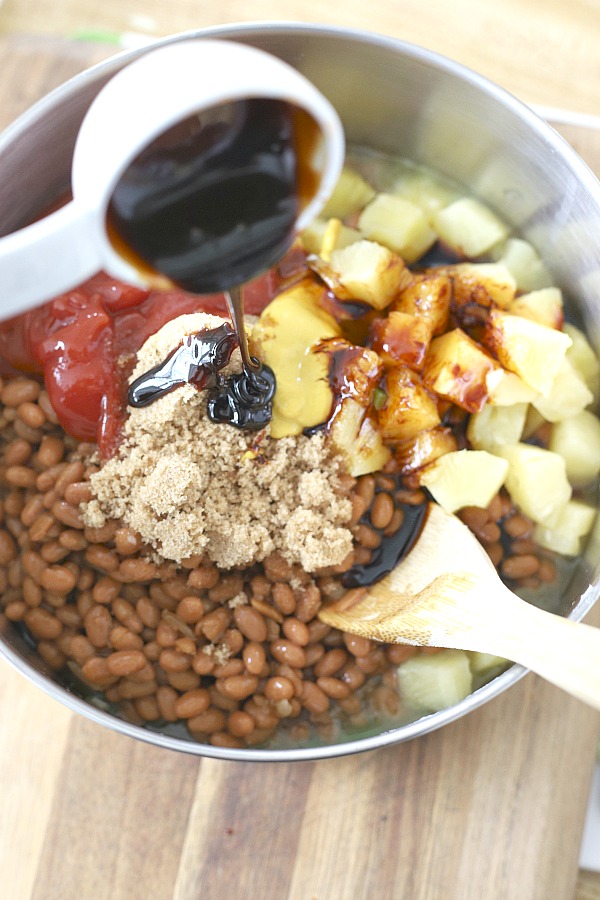 Everyone's favorite cookout side, Hawaiian Baked Beans with pineapple, molasses and brown sugar is quick and easy. Make this recipe on the stove top or bake in the oven. A perfect side for burgers and hotdogs.