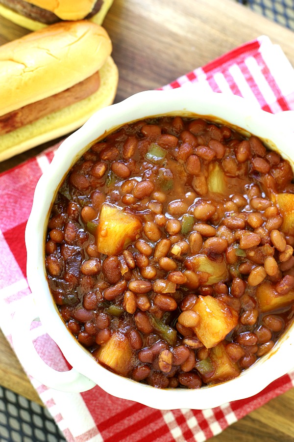 Hawaiian Baked Beans are sweet and delicious with chunks of pineapple, bell pepper and molasses for lots of flavor. Easy recipe can be made on the stove top or baked in the oven. 