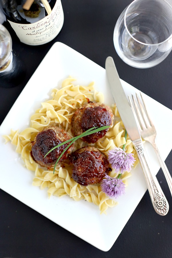 Delicious baked ham balls are a combo of leftover ham and ground beef. Topped with barbecue sauce, baked and served with noodles, pasta or rice for a great weeknight dinner.