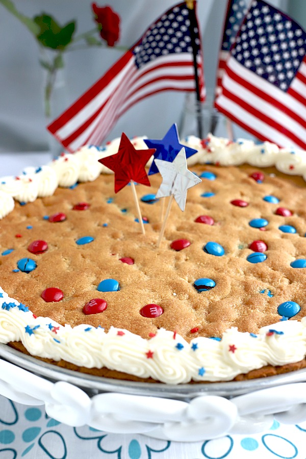 Quick, easy and festive, a giant patriotic peanut butter cookie pizza is a simple recipe the whole family will love for 4th of July or birthday celebrations. 