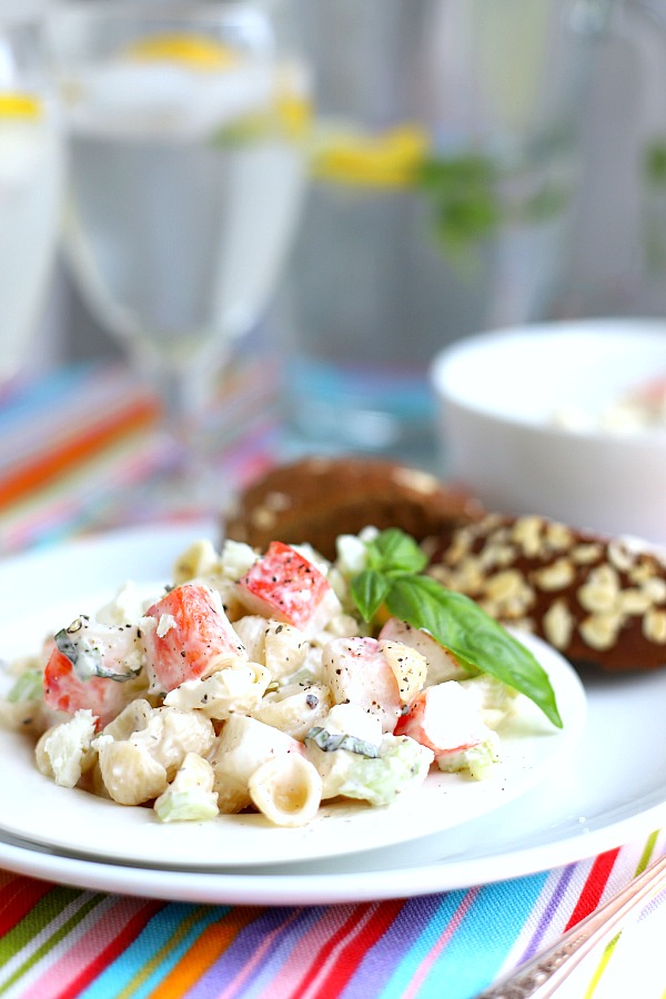 Light and easy to make, pasta crab salad for two is great for lunch or dinner. Imitation crab combines with chopped veggies, basil and cheese in a light creamy dressing.