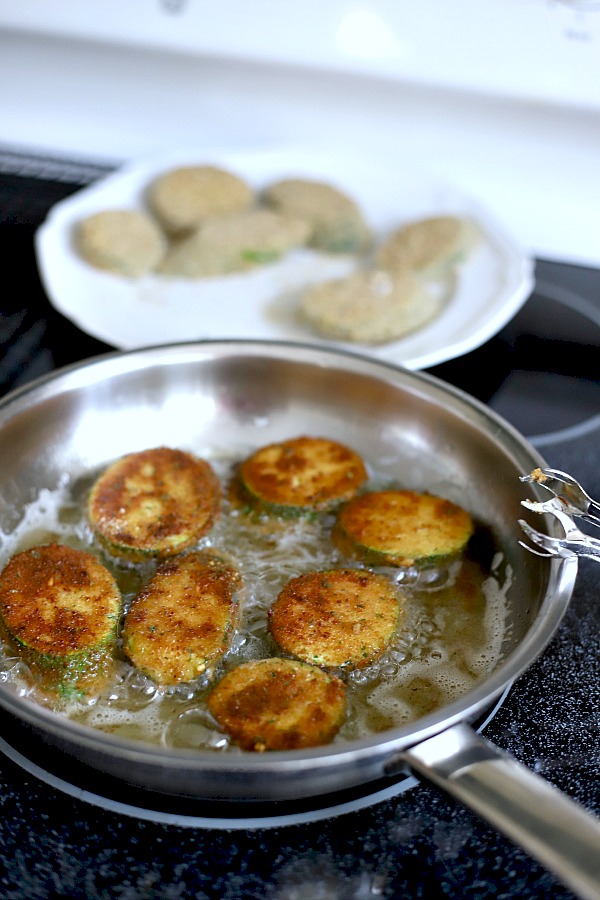 A summertime favorite, breaded fried zucchini is a great side or appetizer. Easy recipe using just a few ingredients and cooked in a skillet until golden brown and crispy.