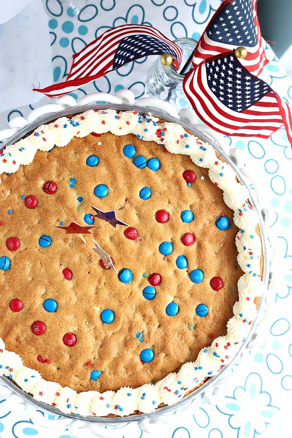 Quick, easy and festive, a giant patriotic peanut butter cookie pizza is a simple recipe the whole family will love for 4th of July or birthday celebrations. 