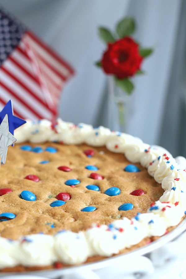 An easy recipe for family parties to celebrate the 4th of July the whole family will love. Patriotic peanut butter cookie pizza is simple and festive for 4th of July, summer entertaining or birthdays.
