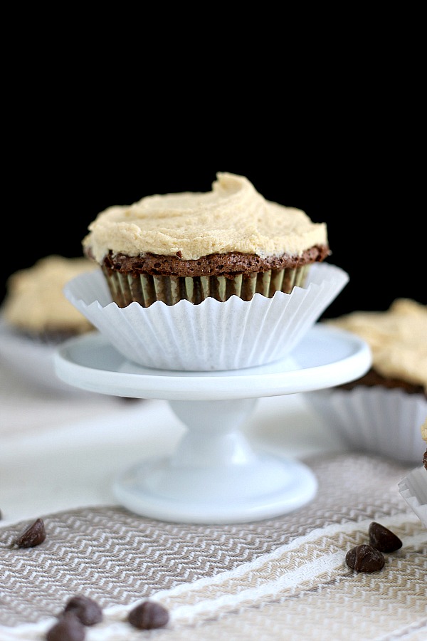 Easy recipe for a moist and decadent chocolate zucchini cupcakes pairs perfectly with peanut butter frosting for a special dessert. No one will even notice the healthy zucchini in the batter.