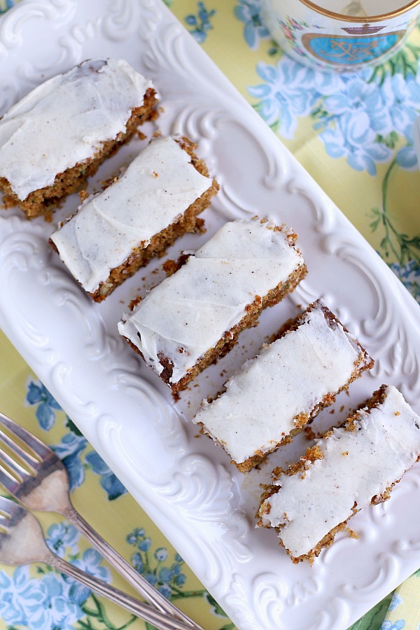 Zucchini bars with spice frosting are moist, delicious pack a lot of flavor in each piece. The frosting has a hint of cloves that perfectly complements and makes them irresistible.