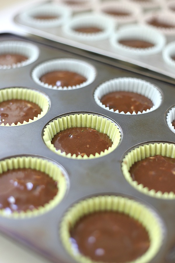 Easy step-by-step recipe for making super moist chocolate zucchini cupcakes with a creamy peanut butter frosting.