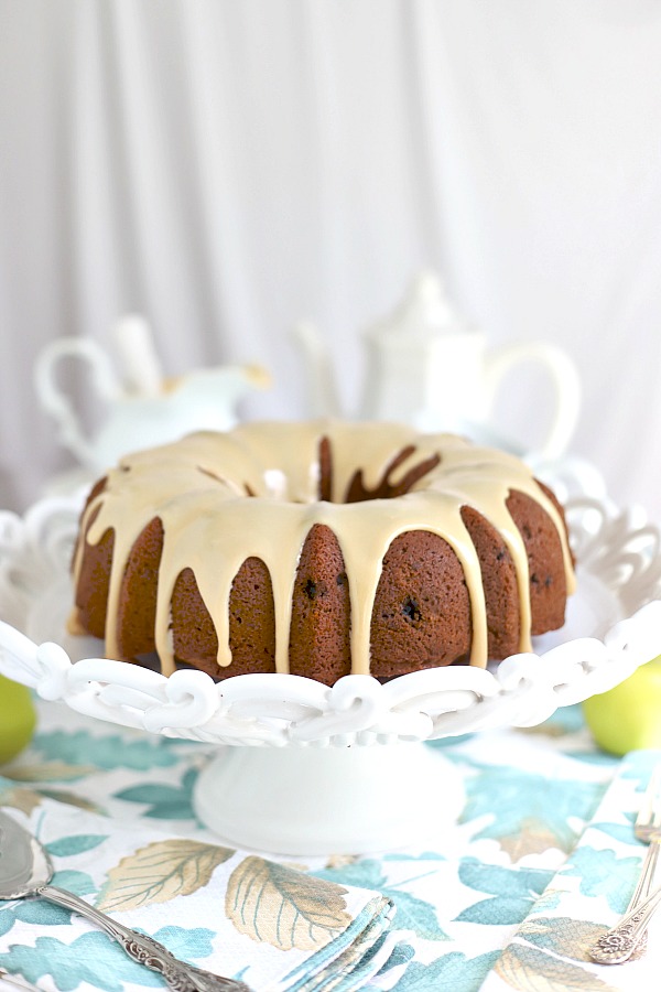 Easy recipe for old-fashioned applesauce cake with over-the-top delicious caramel spread. A perfectly spiced fall dessert that is exceptionally moist.