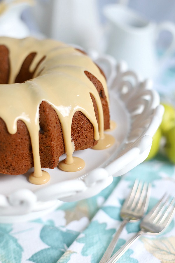 A topping of sweet caramel makes this already moist and delicious applesauce cake extra special. An easy recipe, old-fashioned Bundt cake is a perfectly spiced fall dessert.